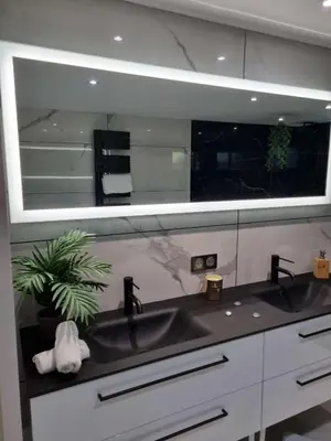 a bathroom with a sink and a large mirror at Villa contemporaine in Pernes-les-Fontaines