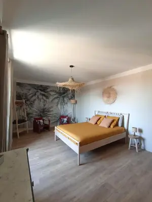 a bedroom with a bed and a ceiling at Maison Rosiris in Pernes-les-Fontaines