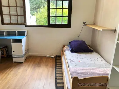 a small room with a bed and a desk at Le domaine de Gaïa in Aix-en-Provence