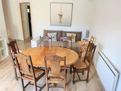 a dining room with a wooden table and chairs at Le domaine de Gaïa in Aix-en-Provence