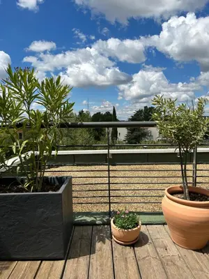 a balcony with two potted plants on a roof at Studio Nuitée en Provence 2 in Aix-en-Provence