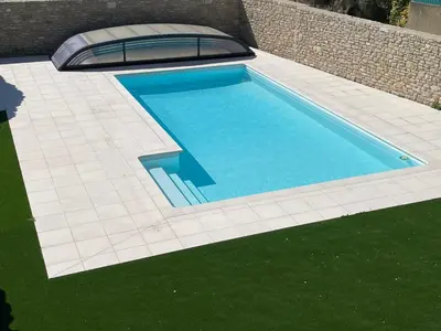 an overhead view of a swimming pool in a backyard at Clos du Cardinal avec piscine in LʼIsle-sur-la-Sorgue