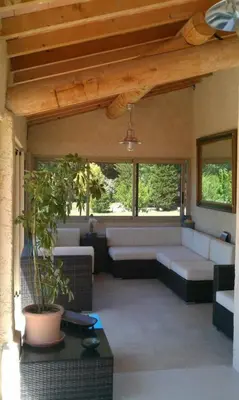 a living room with a couch and a table at Gîte la Saume in Lambesc