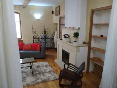 a living room with a couch and a fireplace at La Mauricette - free Parking & Cancellation - WiFi in Pélissanne