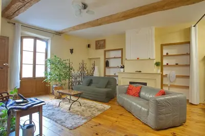 a living room with a couch and a table at La Mauricette - free Parking & Cancellation - WiFi in Pélissanne