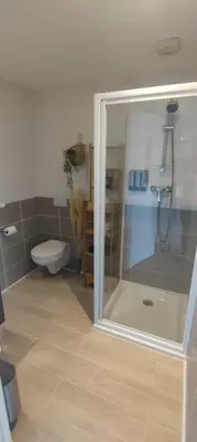 a bathroom with a shower and a toilet at 107 Paisible et unique avec terrasse sur vue piscine in Éguilles