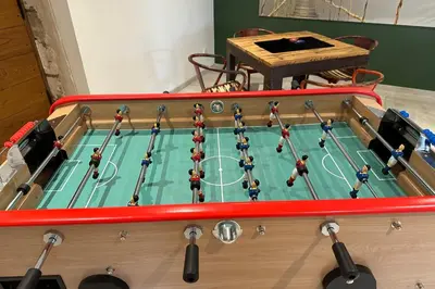 a table with a soccer game on it at Mas Sylvie - Isle-sur-la-Sorgue in LʼIsle-sur-la-Sorgue