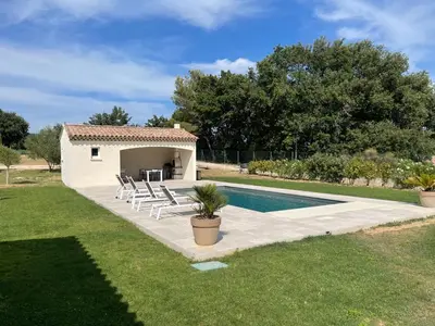 a villa with a pool and a house at La Bastide Cezanne Natural elegance in Aix-en-Provence
