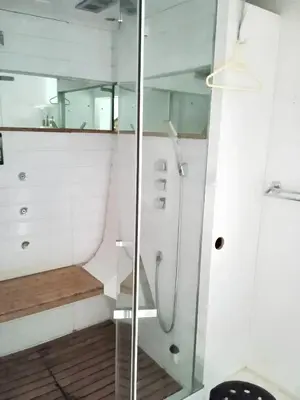 a shower with a glass door in a bathroom at Appartement spacieux à Aix-en-Provence 100 m² avec hammam in Aix-en-Provence