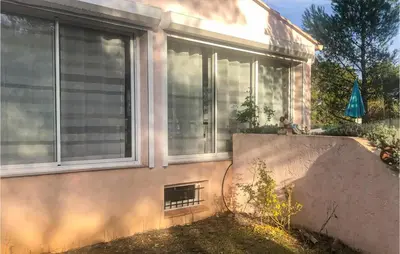 a house with a window with blinds on it at 3 Bedroom Cozy Home In Meyrargues in Meyrargues