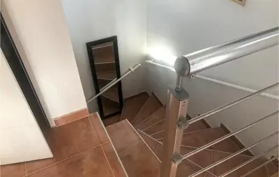 a stairwell with a metal railing and a stair case at 3 Bedroom Cozy Home In Meyrargues in Meyrargues