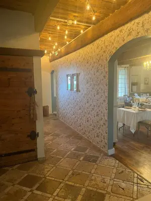 a dining room with a table and a door at Maison Bournissac in Noves