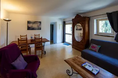 a living room with a couch and a table at Gites Provence et Nature - Ambiance familiale et conviviale en Luberon in Cabrières-dʼAvignon