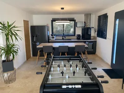 a living room with a large foos ball at Luxury House Family’s in Carpentras