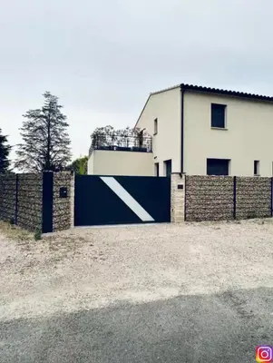 a blue fence in front of a house at Luxury House Family’s in Carpentras