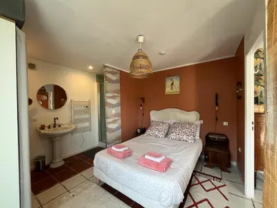 a small bedroom with a bed and a sink at Terrama de l'isle in LʼIsle-sur-la-Sorgue