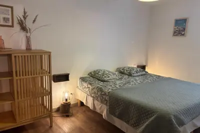 a bedroom with a bed with two pillows on it at 