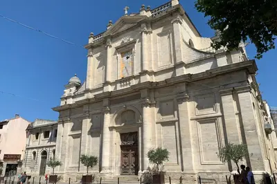 an old building with people standing in front of it at 
