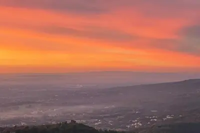 a sunset from the top of a mountain at Under the Provençal Sun in LʼIsle-sur-la-Sorgue