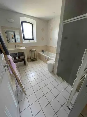 a bathroom with a shower and a toilet and a tub at La Cath - Villa avec piscine - Gordes in Gordes