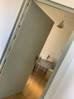 a view of a hallway with a table in a room at Joli studio centre village in Lambesc