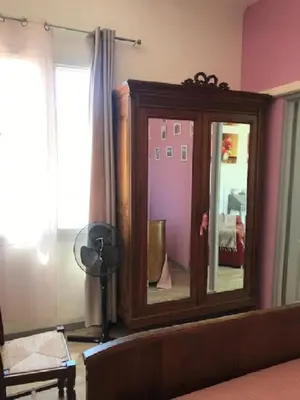 a bedroom with a dresser and a mirror at La Reynière du Sud Luberon in La Bastide-des-Jourdans