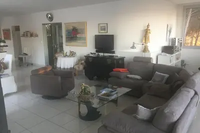 a living room with two couches and a tv at La Beaume in Blauvac