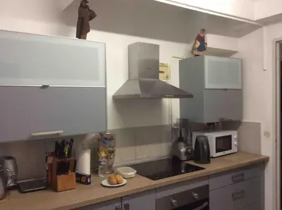 a kitchen with a counter top with a microwave at Les Cerisiers. in Aix-en-Provence
