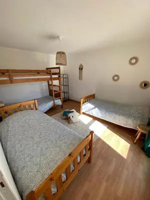 a room with two bunk beds in a room at Gîte Lou Pastre in Aureille