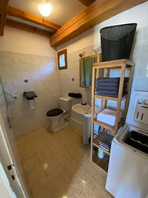 a bathroom with a sink and a toilet and a shower at Gîte Lou Pastre in Aureille