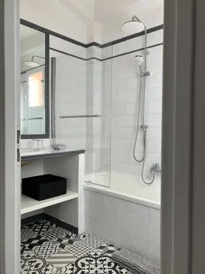 a bathroom with a shower and a tub and a sink at Mas du Clos , Tilleul in Roussillon