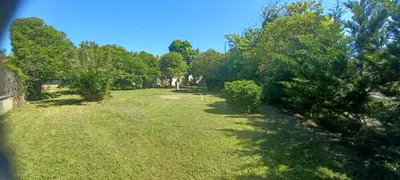 a yard with trees and grass and a fence at maison 4 à 6 personnes proche village in Pélissanne