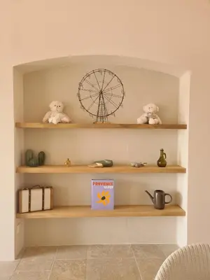 a shelf with two teddy bears and a ferris wheel on it at Villa de luxe en Luberon - Piscine chauffée in Puget
