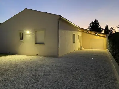 a white house with a driveway in front of it at Moun Cabanoun in Carpentras