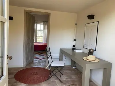 a room with a desk and a chair in a room at In Gordes, facing the entire Luberon Park a beautiful 5 bedrooms house in Gordes