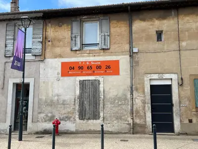 a building with a sign on the side of it at AptCityStay in Apt