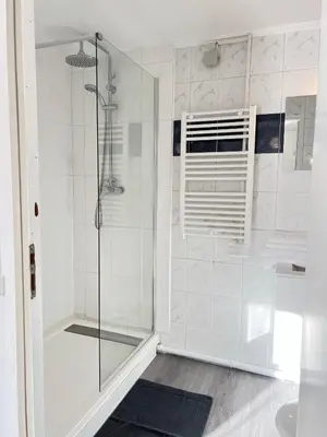 a bathroom with a shower with a glass door at AptCityStay in Apt