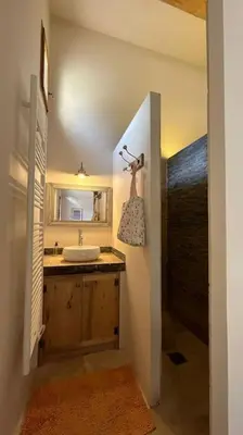 a bathroom with a sink and a mirror at La Terrasse Collongue in Lourmarin