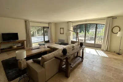 a living room with a couch and a table at La Terrasse Collongue in Lourmarin