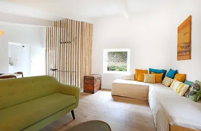 a living room with a couch at La petite Maison de Gordes in Gordes
