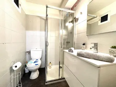 a bathroom with a toilet and a glass shower at *Le Sahara*Hyper Centre*Wifi* in Salon-de-Provence