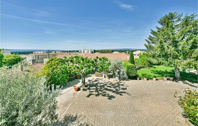 an overhead view of a garden with trees and a building at 2 Bedroom Amazing Home In Châteaurenard in Châteaurenard
