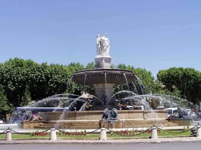 a fountain with two fountains in a park at Studio au cœur d'Aix avec balcon et parking in Aix-en-Provence