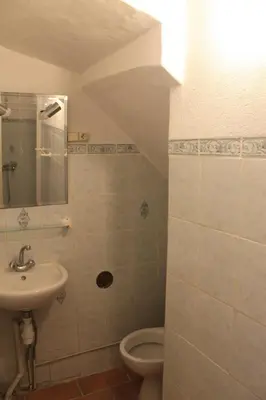a bathroom with a sink and a toilet at L' ABBADIE in Carniol