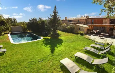 a yard with chairs and a swimming pool at Gorgeous Home In Sault in Sault-de-Vaucluse