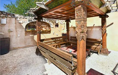a wooden bed with a wooden roof on top at Gorgeous Home In Sault in Sault-de-Vaucluse