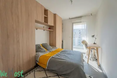 a bedroom with a bed and a chair and a window at Superb Apartment - Downtown Aix-en-Provence in Aix-en-Provence
