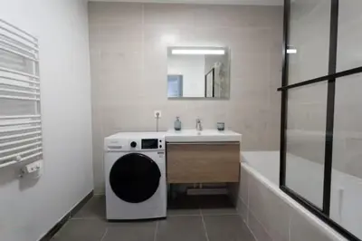 a bathroom with a sink and a washing machine at Superb Apartment - Downtown Aix-en-Provence in Aix-en-Provence
