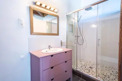 a bathroom with a sink and a shower at La Bastide des Joncquiers in LʼIsle-sur-la-Sorgue