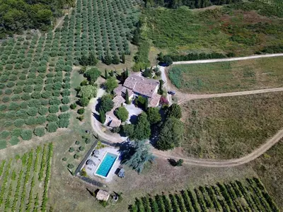 an aerial view of a farm with a house and a pool at Domaine du Coffre in Pertuis